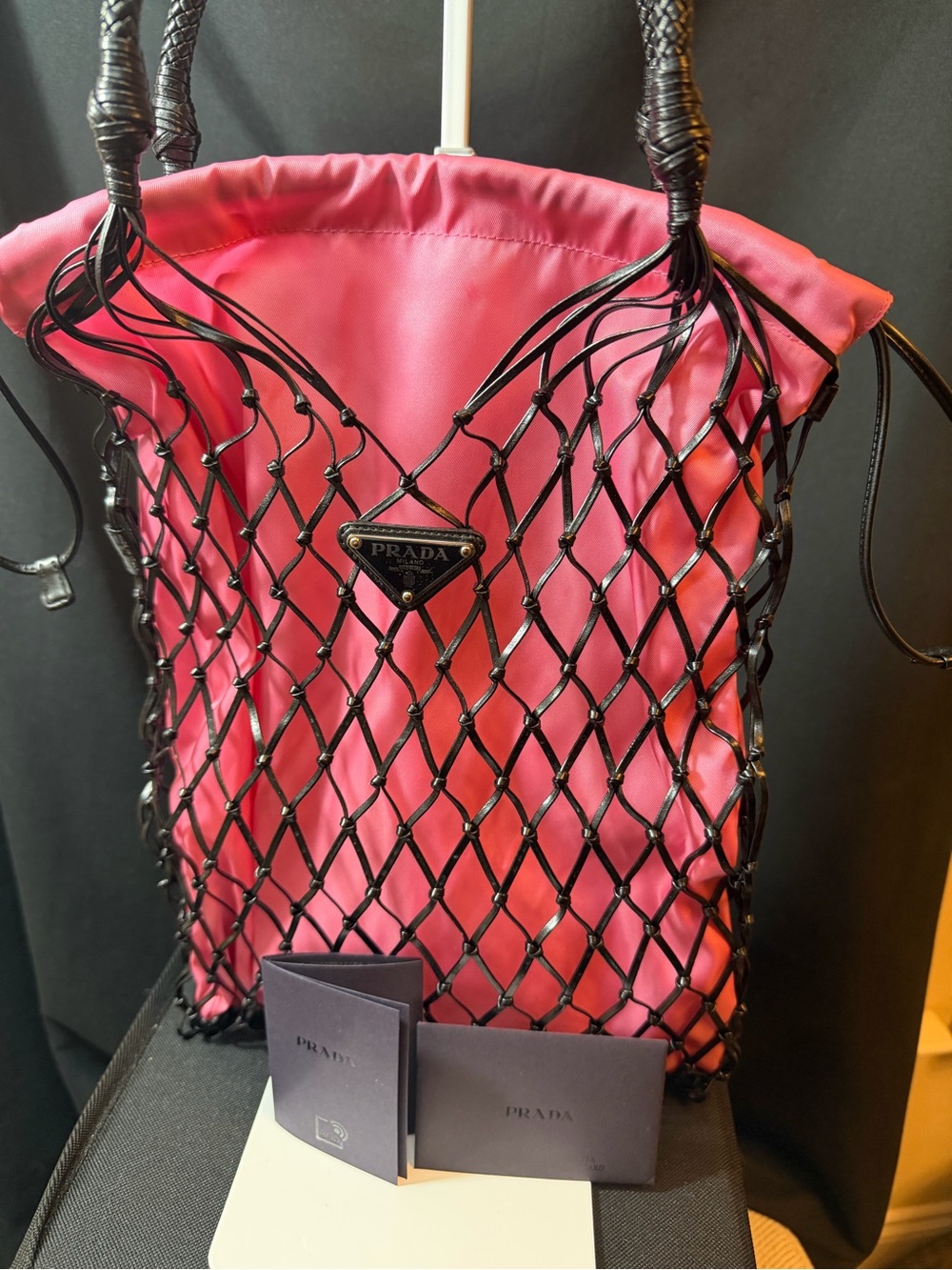 This is a Prada Tessuto Nylon Net Tote in pink and black. Brand New Never Used.